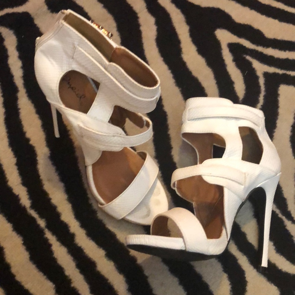 White strap heel with gold buckles